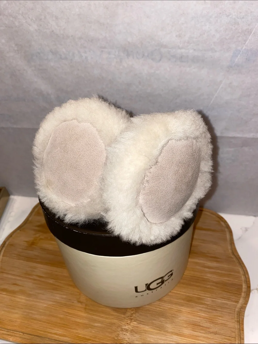 UGG Plush Shearling Ear Muffs in Light Beige with Gold Buckle